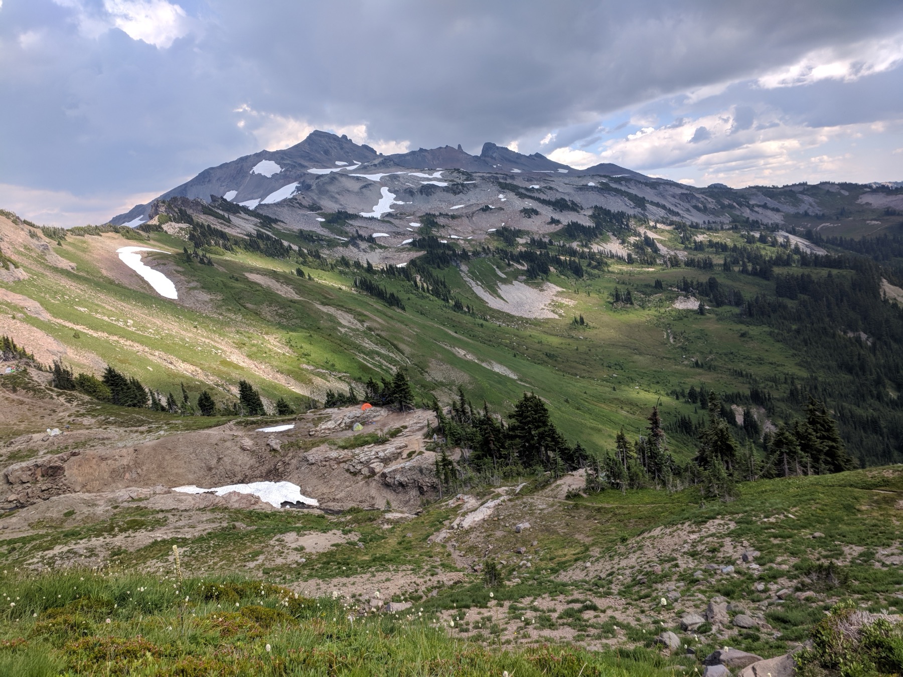 Wide alpine view near Mount Rainier under dramatic clouds