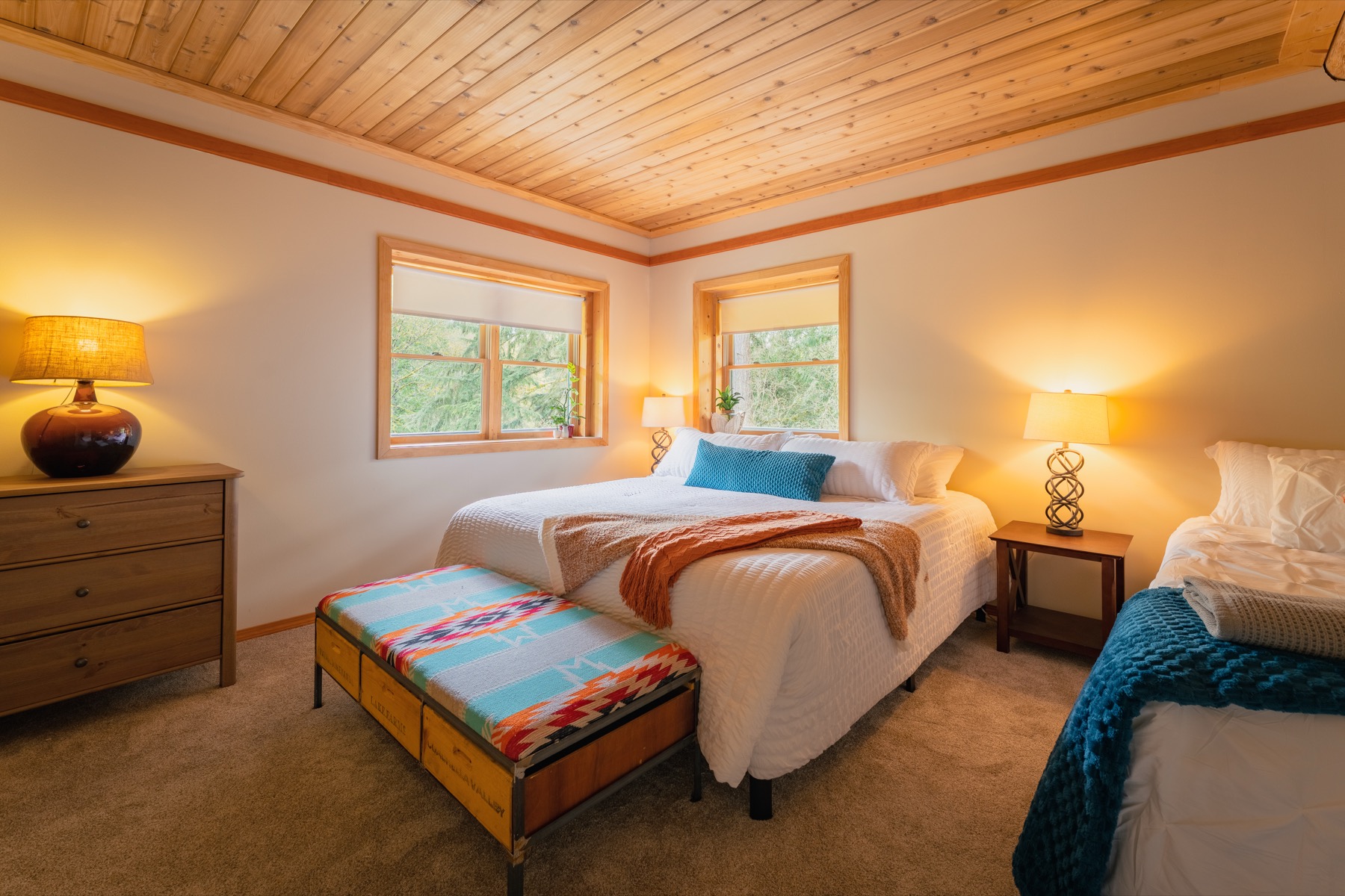 Warm bedroom setup for overnight event guests at Blue Roof Lodge